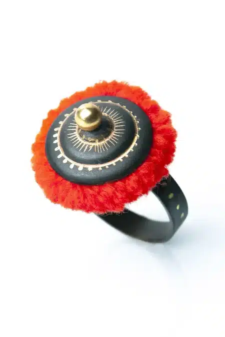 Engraved bronze ring with red pompom main
