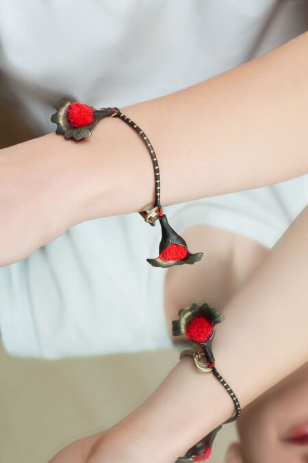Handmade Jewellery | Flowers engraved bronze bracelet with red tassels gallery 2