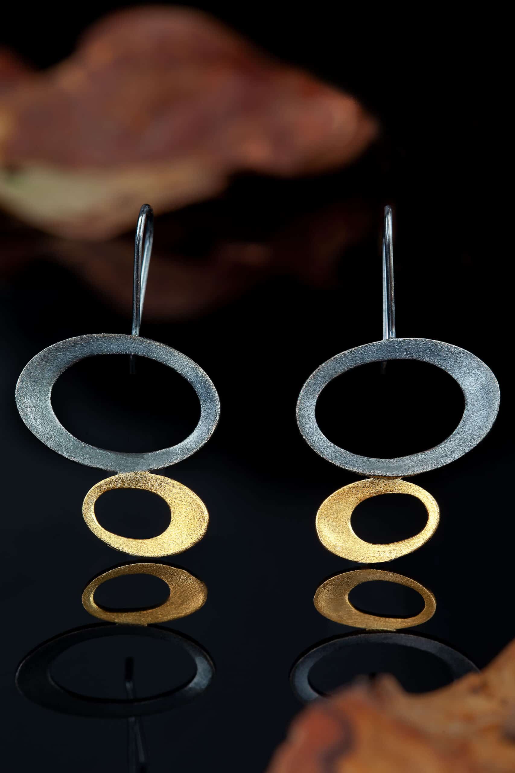 Geometric gold and black rhodium plated silver earrings main
